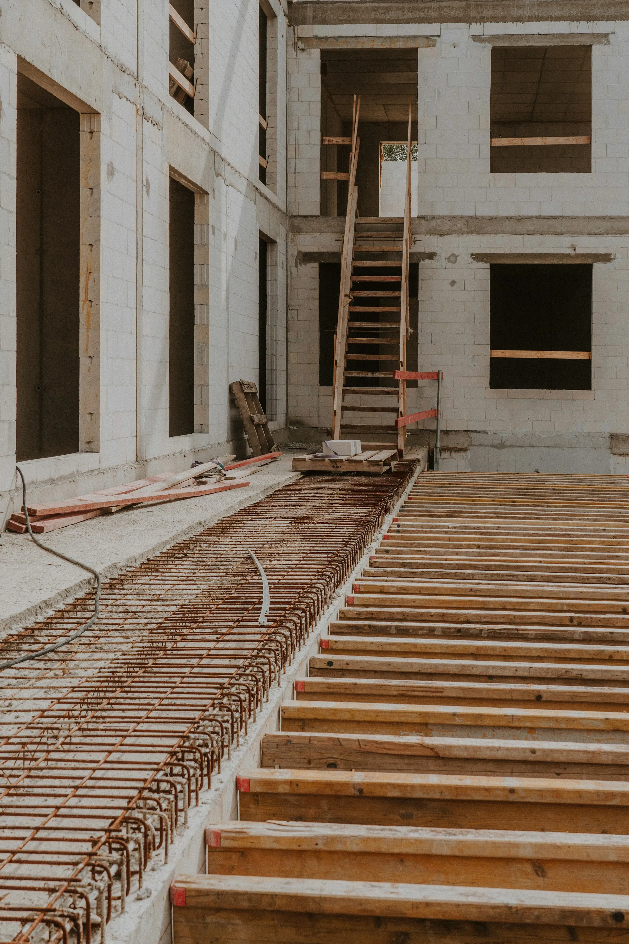 Rebar and forms laid out inside a building foundation